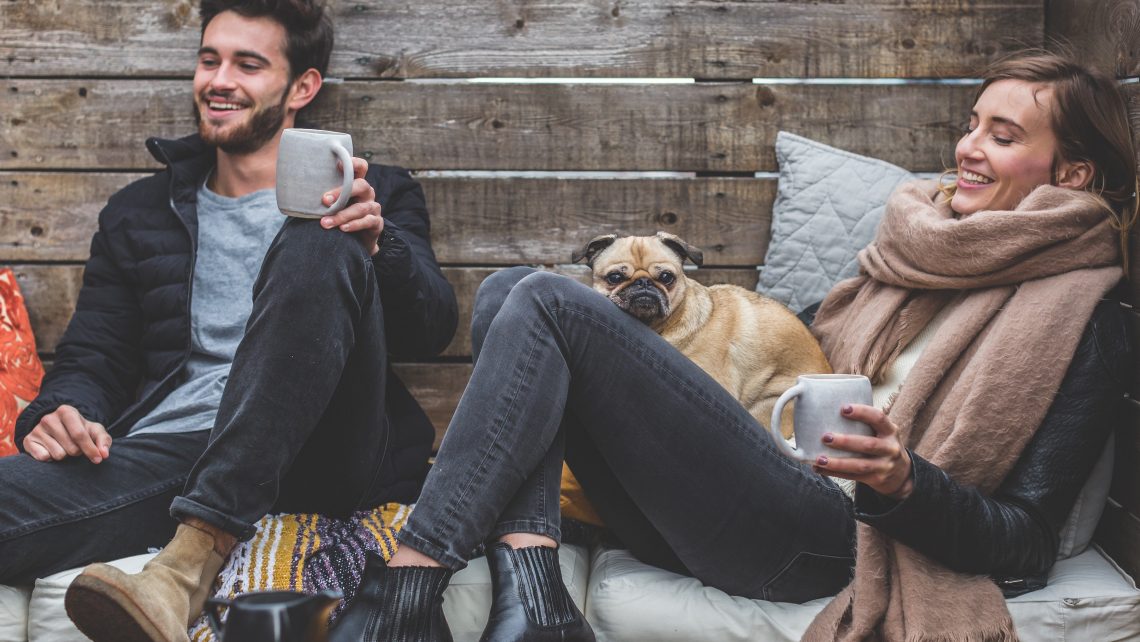 couple with cold cozy dog
